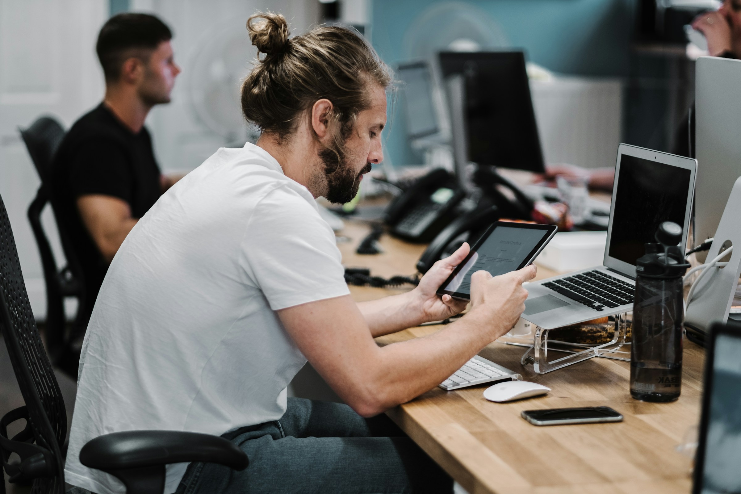 man working on tablet - Mailstrom vs. Clean Email