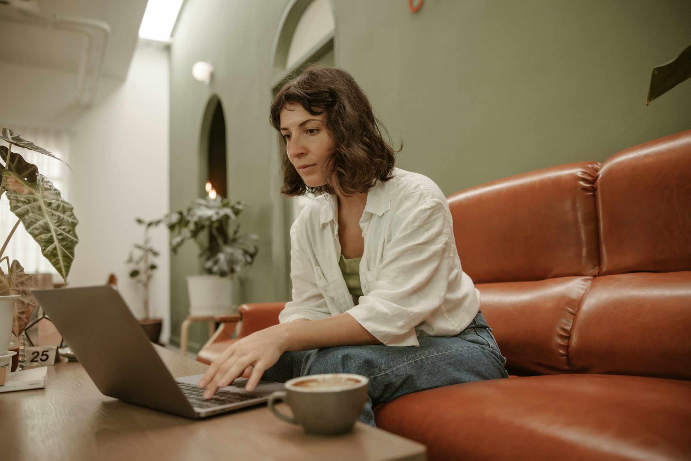 woman using a laptop -  How to Delete Large Amounts of Emails in Gmail 