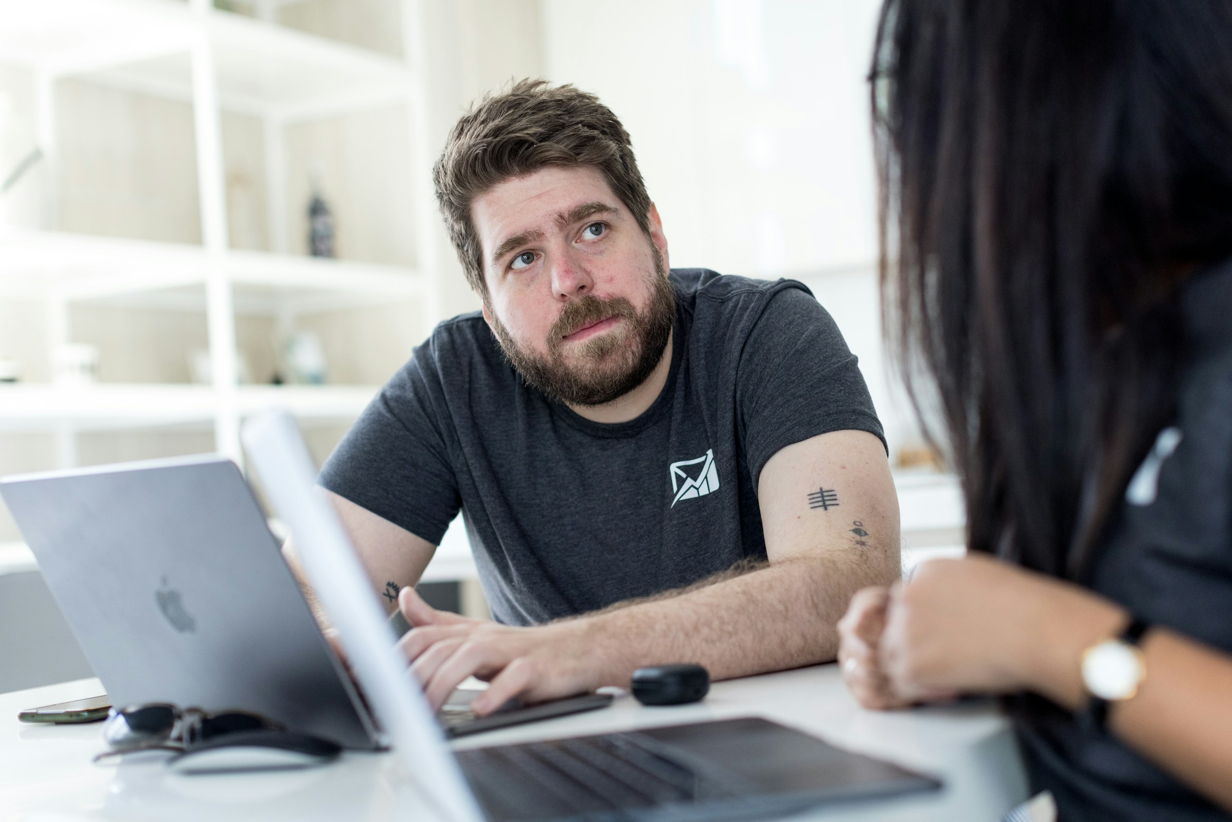 employees working on a laptop - How to Clean Up Email 