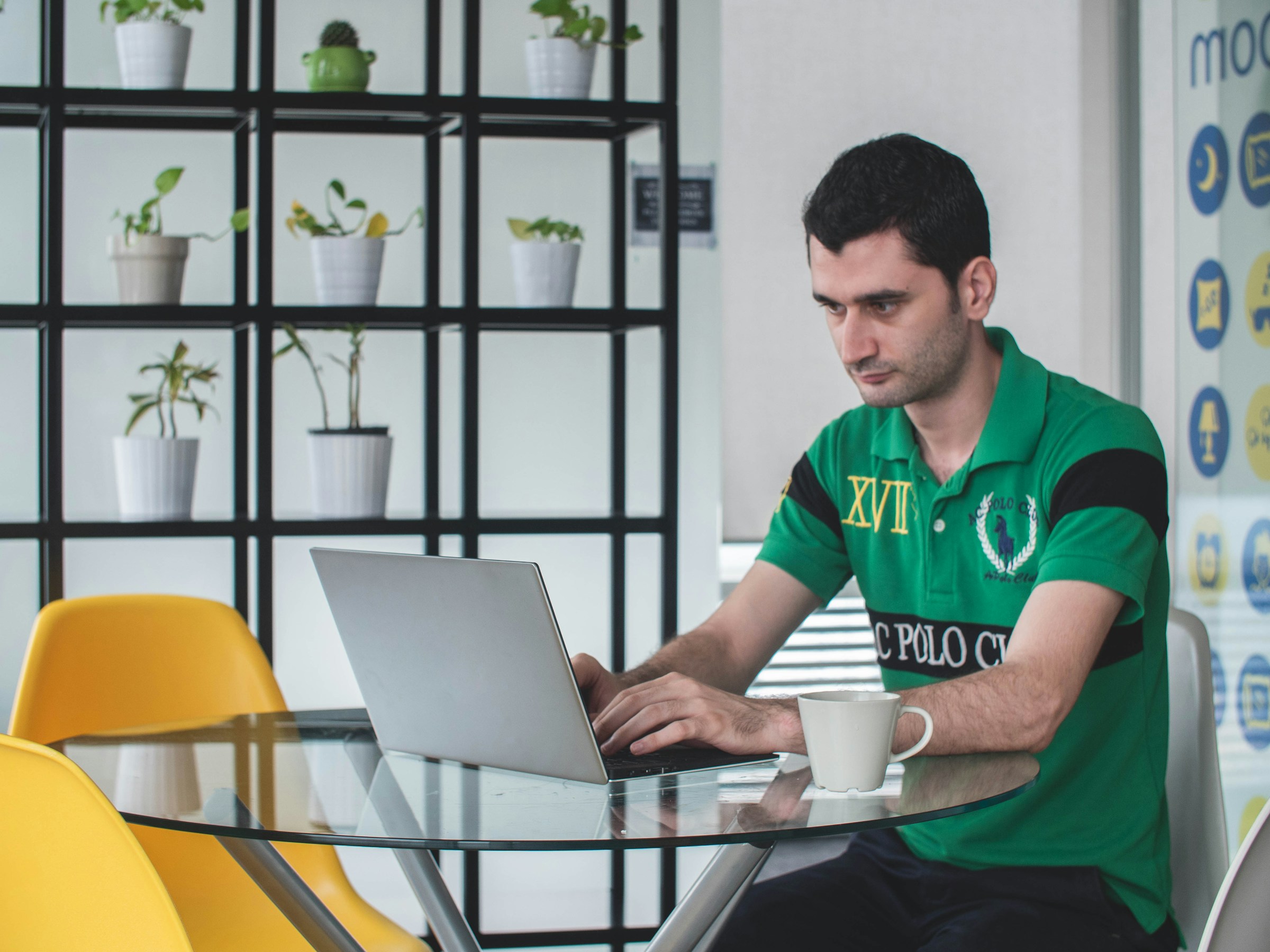 man working on a laptop - Mailstrom vs. Clean Email