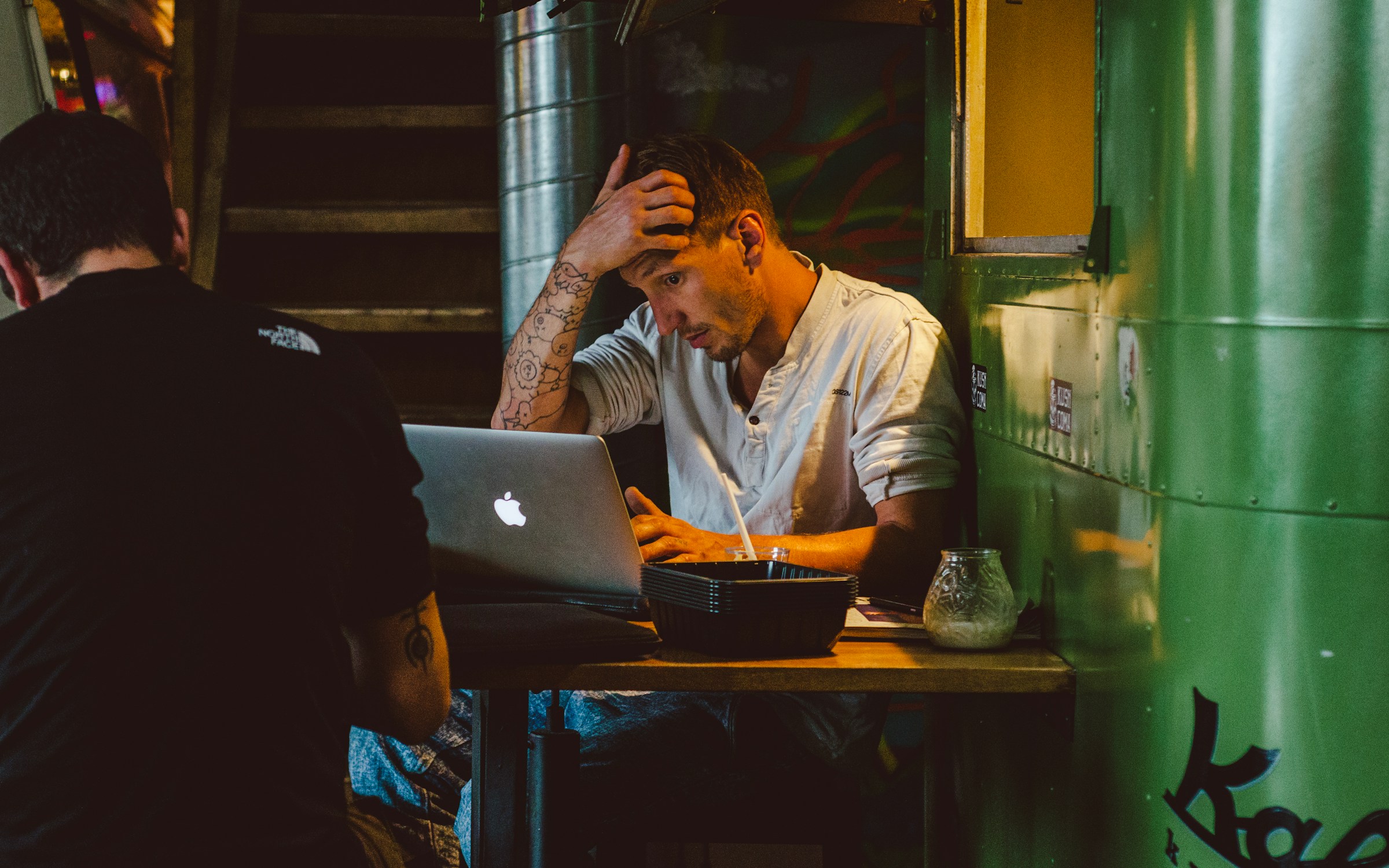 man working on a laptop - Mailstrom vs. Clean Email