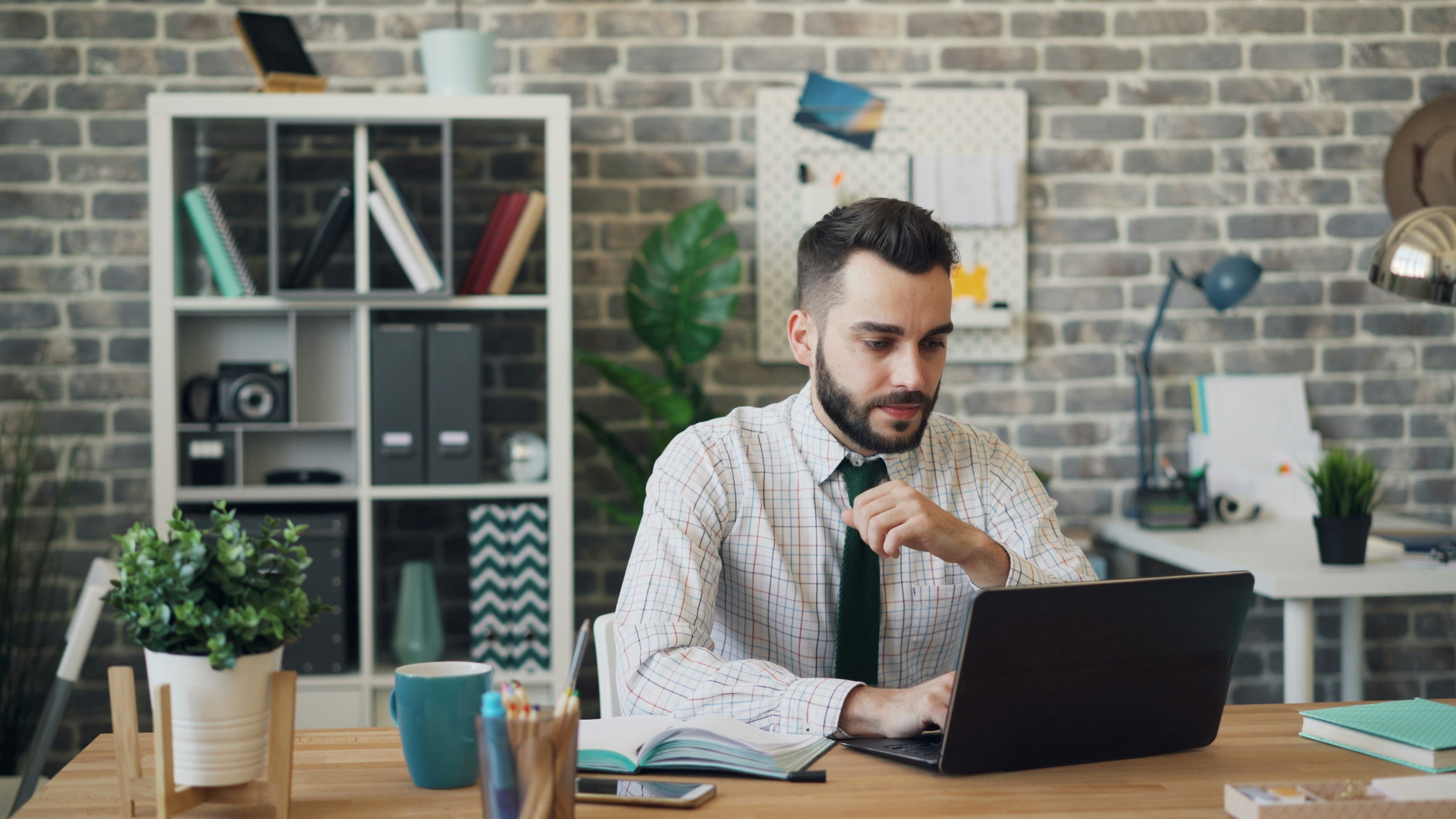 man on a laptop - How to Unsubscribe From Emails on Gmail