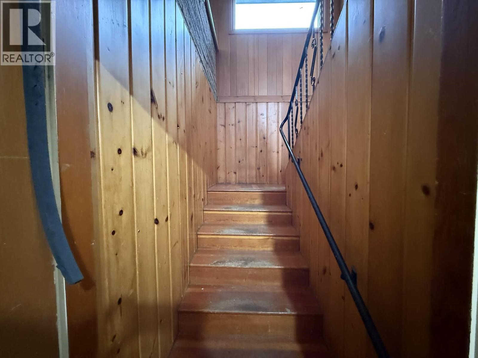 Stairs leading to two bedroom suite.