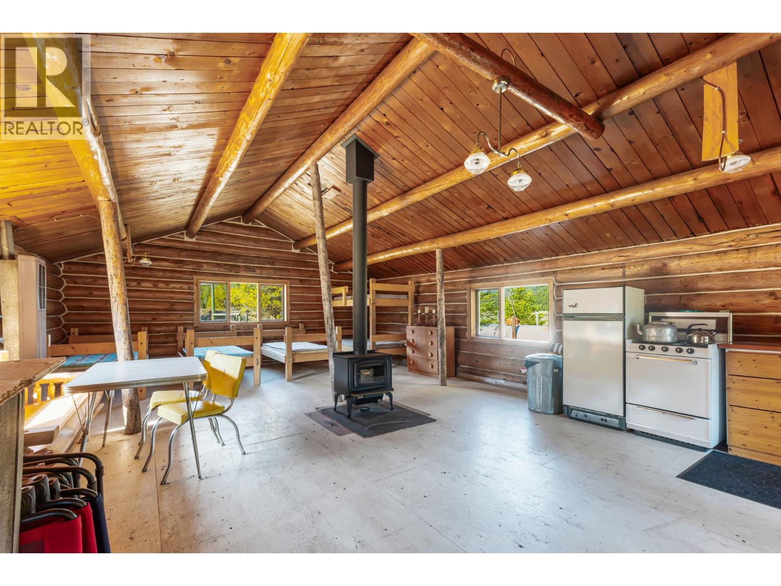 Warm, rustic cabin interior overlooking the wilderness