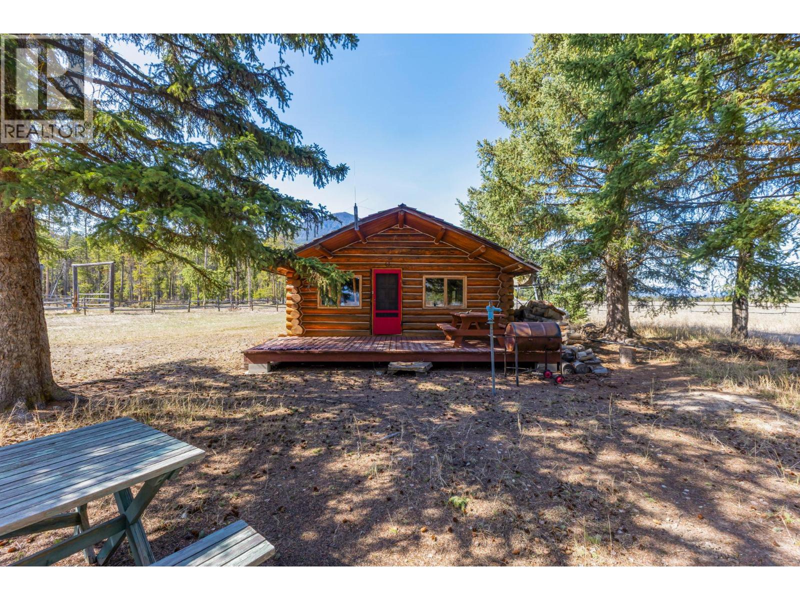 A private log cabin hidden beneath the trees