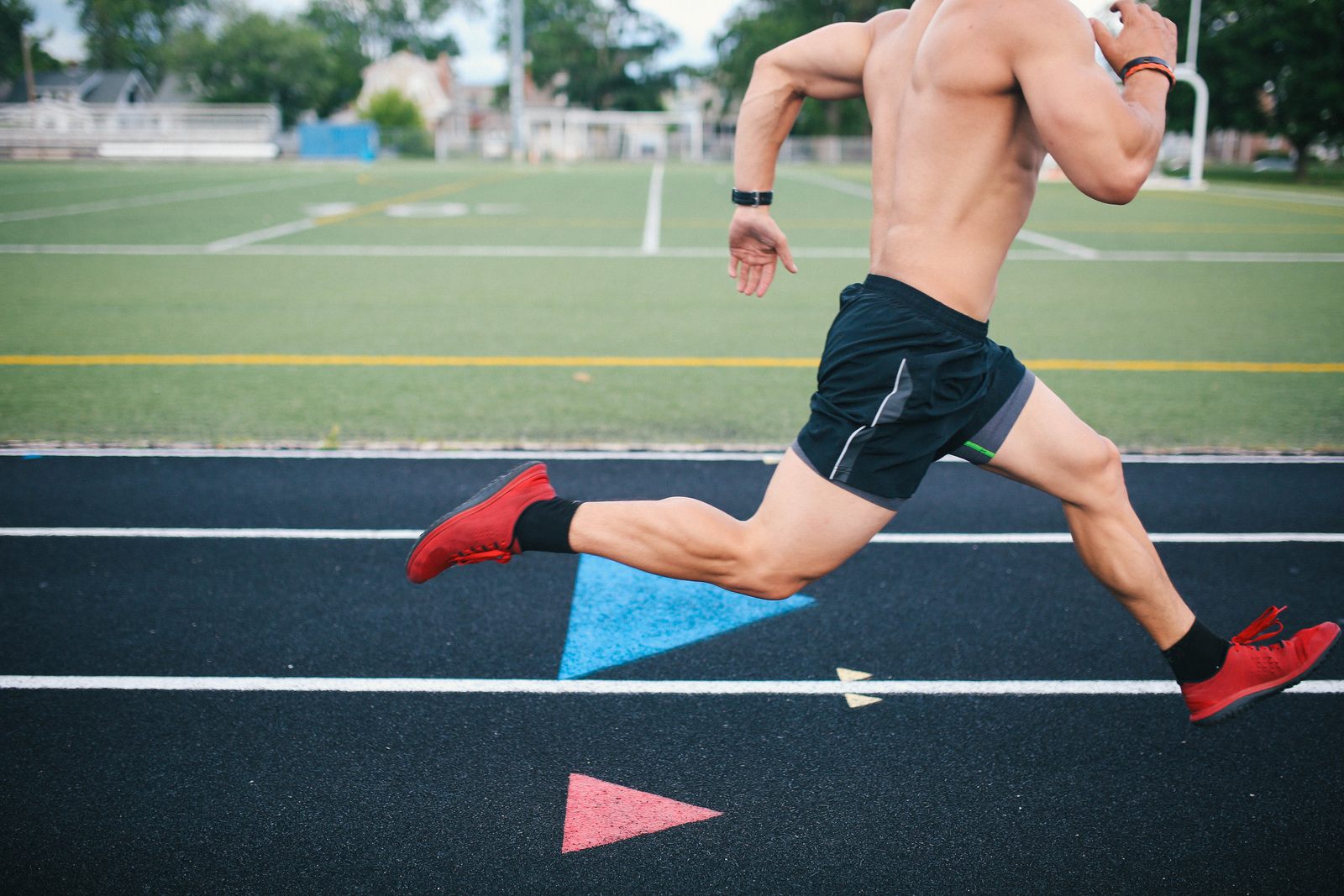 Man sprinting on a track — restored energy and performance