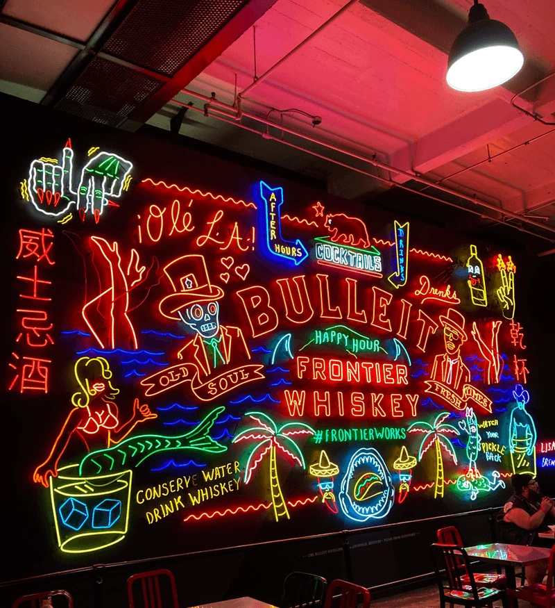 Vibrant neon wall art and custom lighting installed during a restaurant renovation at Grand Central Market in Downtown Los Angeles by Build Solutions