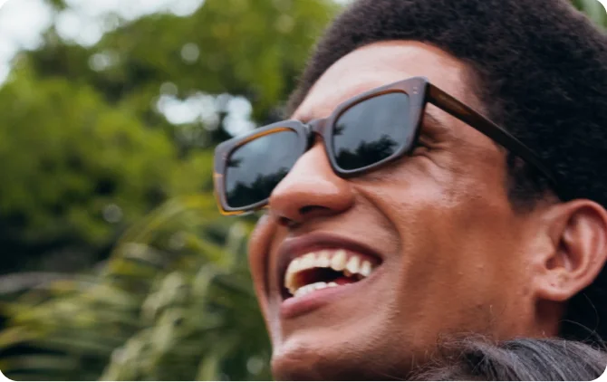 A smiling man in sunglasses