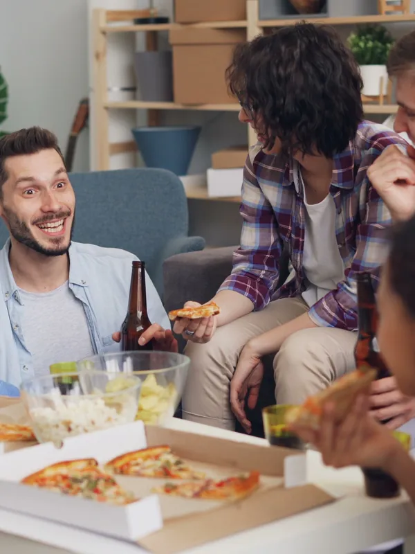 Housemates sharing pizza