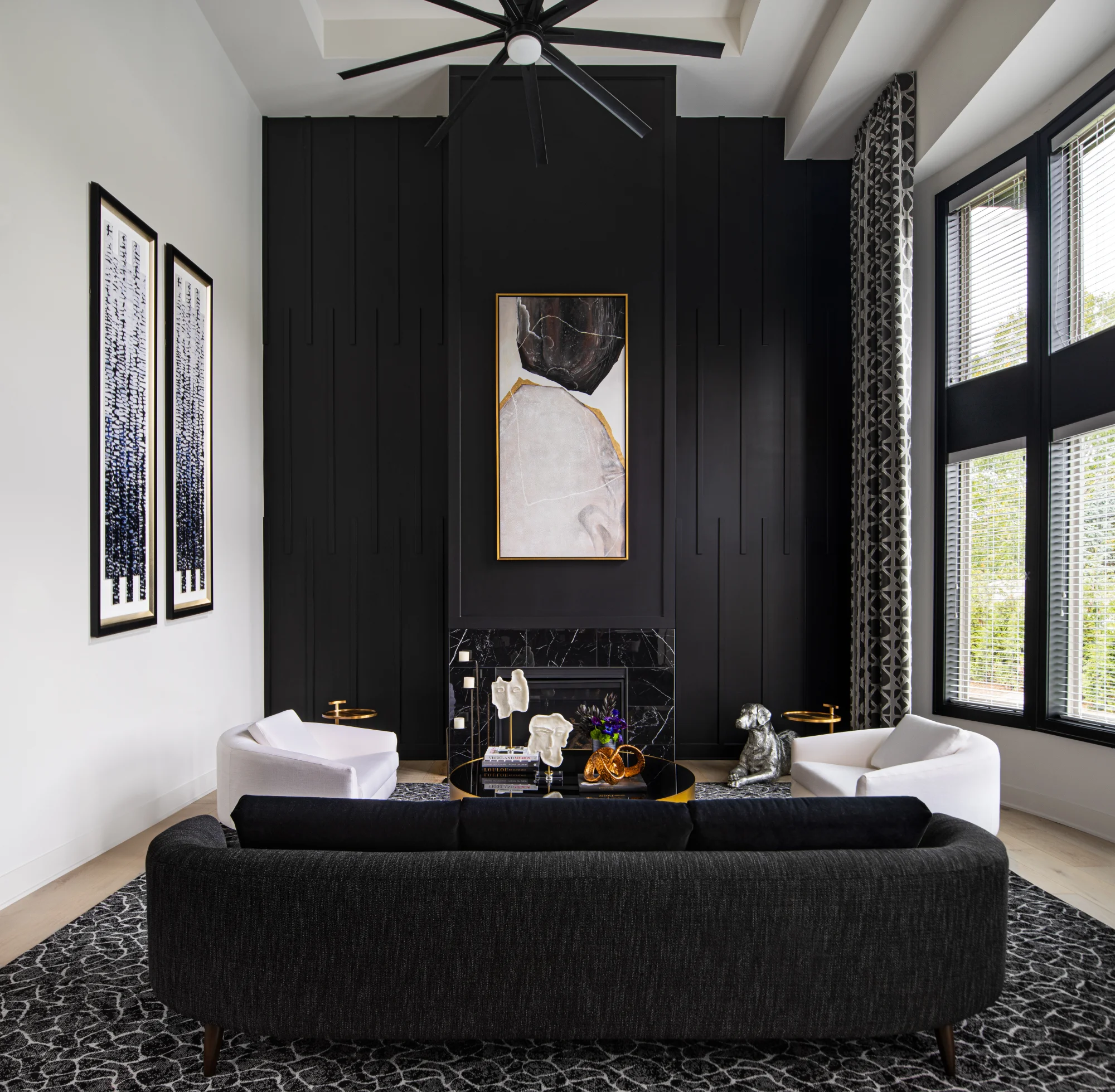 Living room with black feature wall and fireplace at 2113 Kohli Drive, Eden Gardens