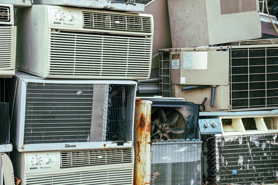 An old, inefficient outdoor AC unit with visible rust and wear - ac installation mcdonald