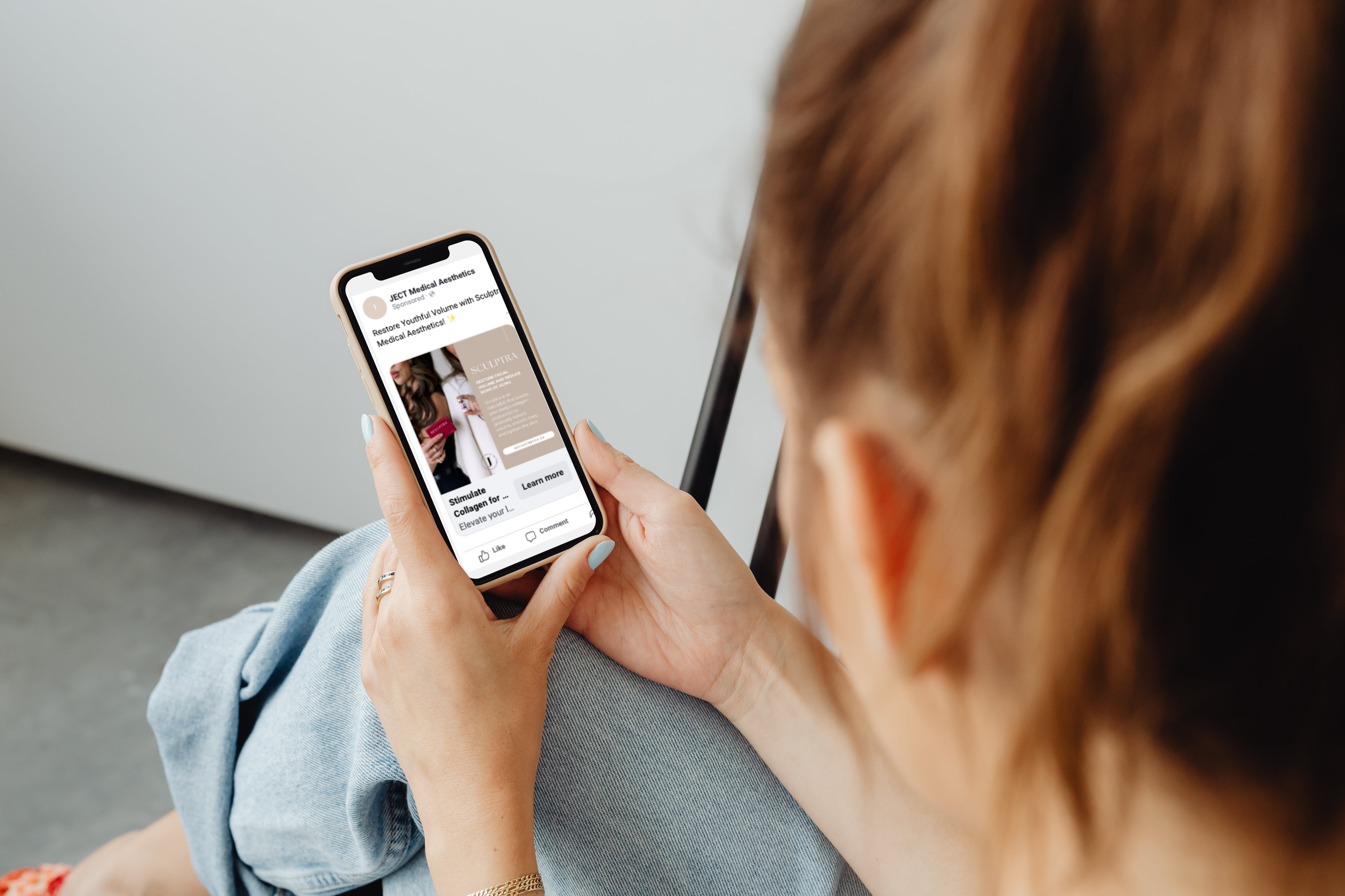 A man writing on a post-it note on a whiteboard