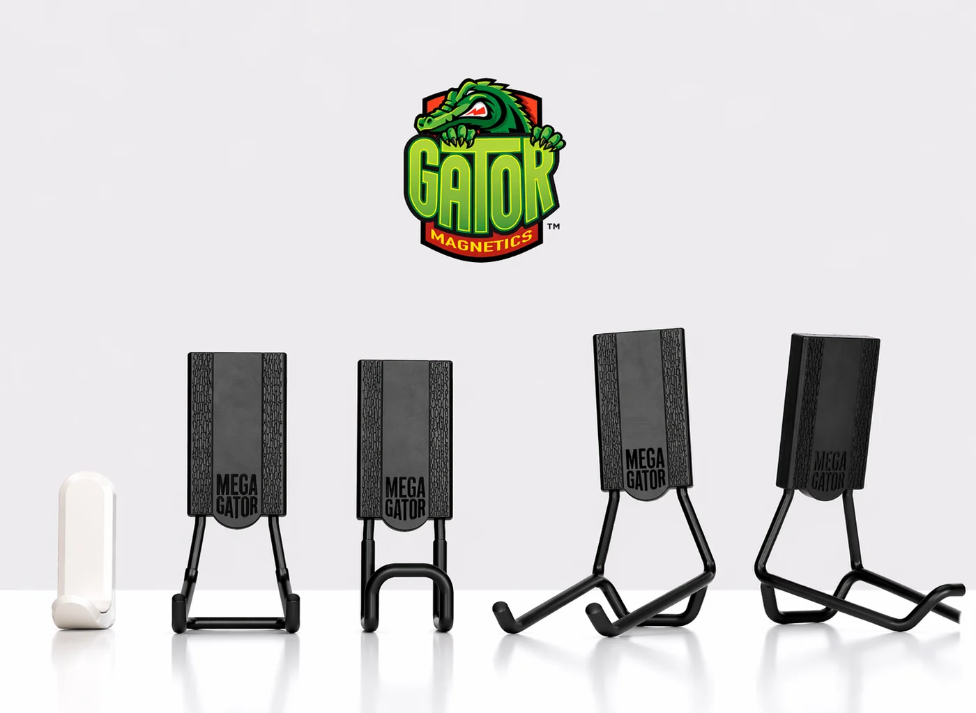 Gator Magnetics hooks holding garden tools and hose on a steel wall