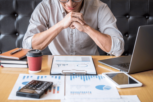 Financial projections spreadsheet for money transmitter license application showing 3-5 year forecasts of transaction volumes, revenues, expenses, cash flow, break-even analysis, and sensitivity scenarios for state regulators.