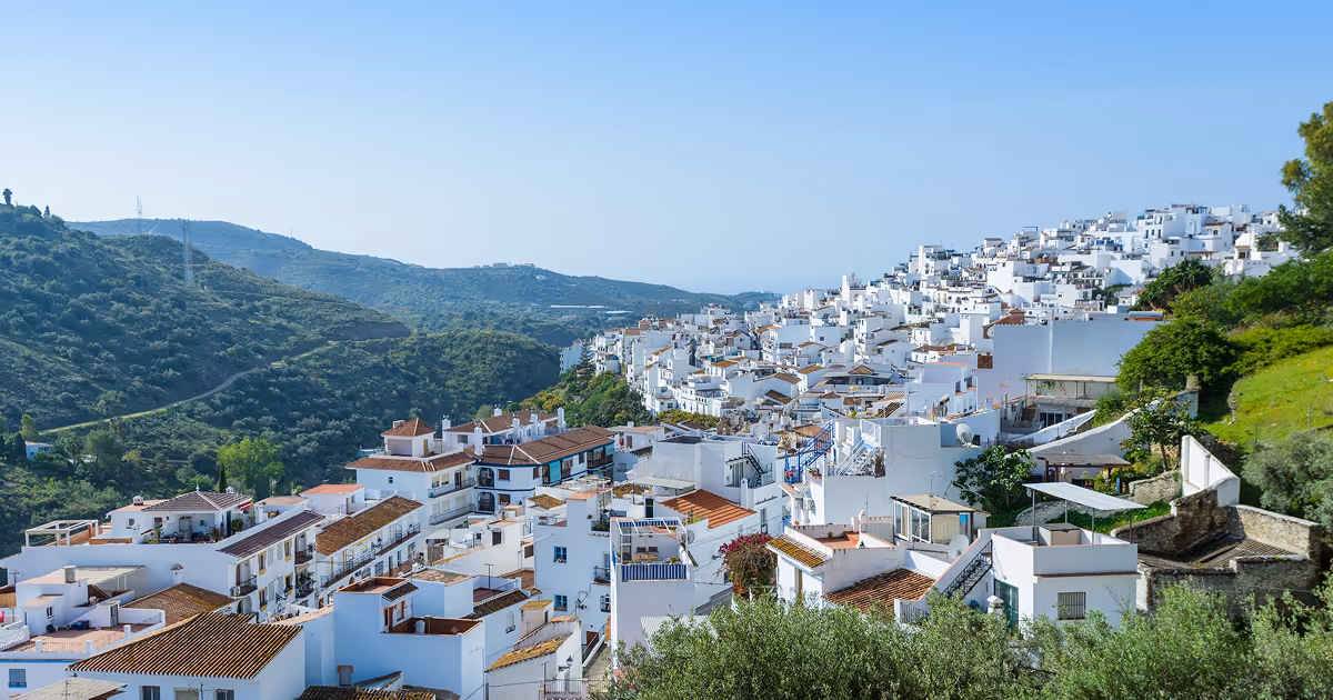 Andalusian Village in Spain, paradise of retirees, with beautiful blue sky behind