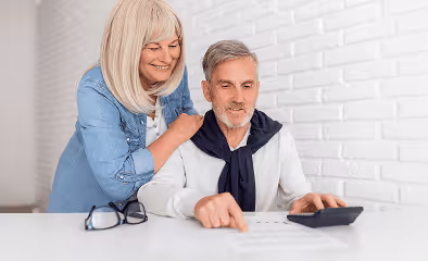 Medium shot couple looking at document
