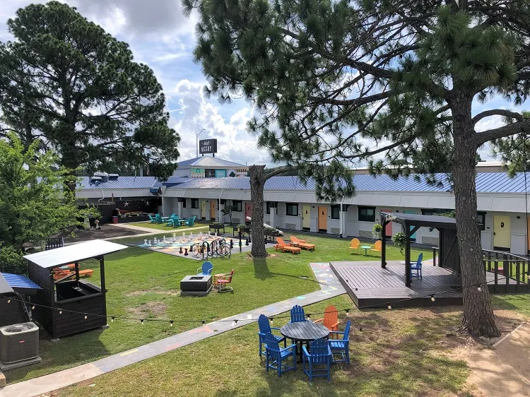 Hotel McCoy College Station courtyard, one of the pet-friendly hotels in College Station, TX.