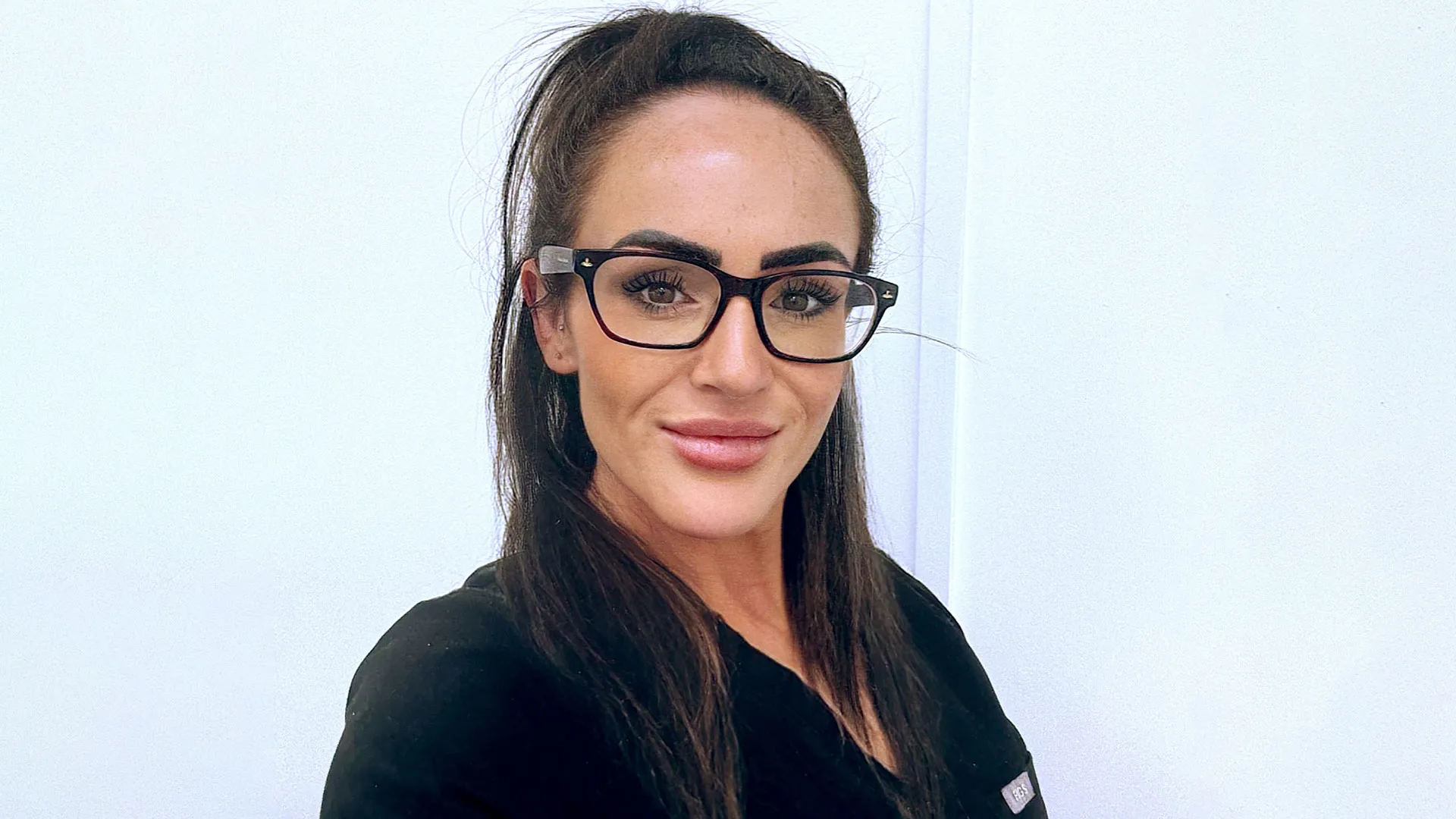 Ellie, patient coordinator at Eden Clinic, in clinic uniform