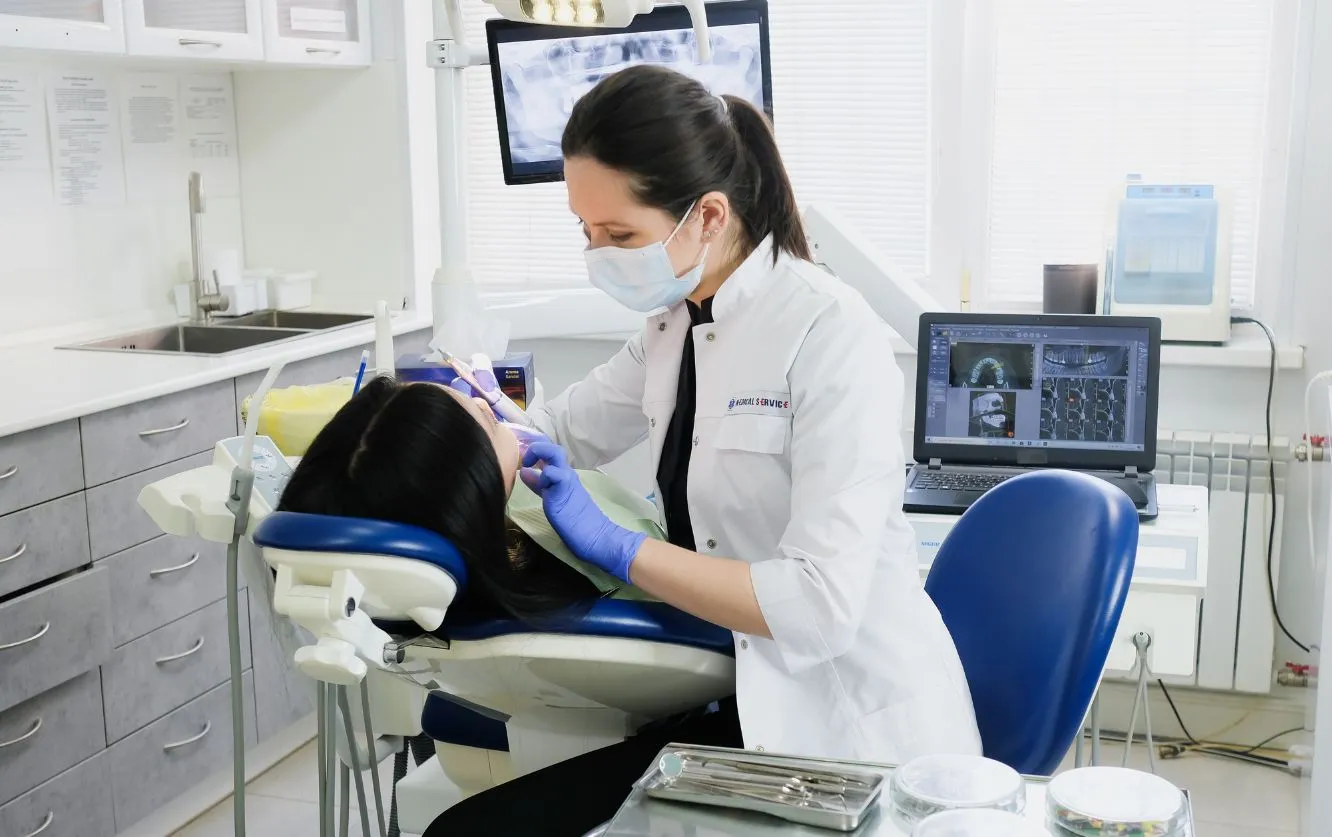 Patient undergoing dental X-ray in a modern clinic.
