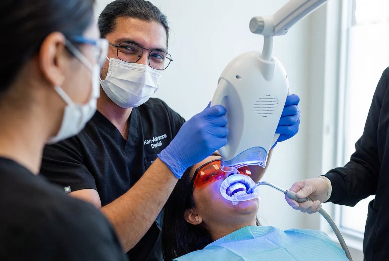Smiling woman with healthy white teeth gently touching her face, representing confidence after cosmetic dental treatment.