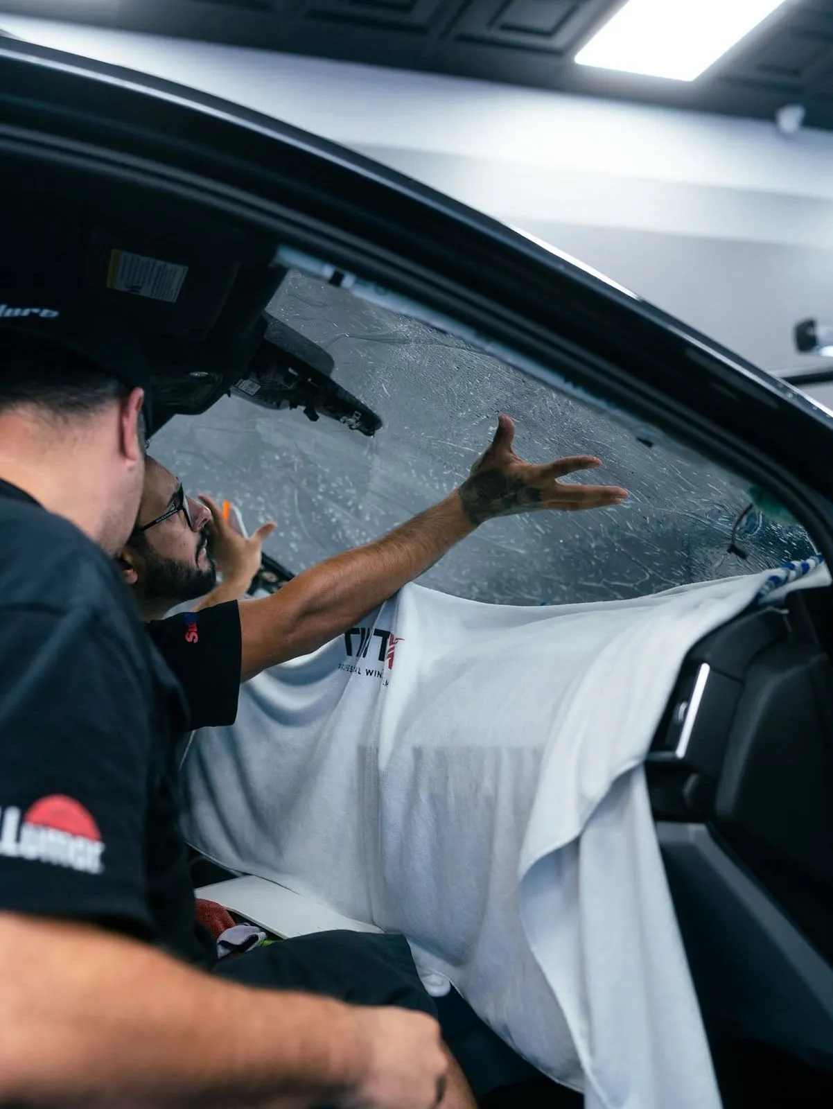 Window tint film installation on a car at Allure Auto Spa, Winter Park FL
