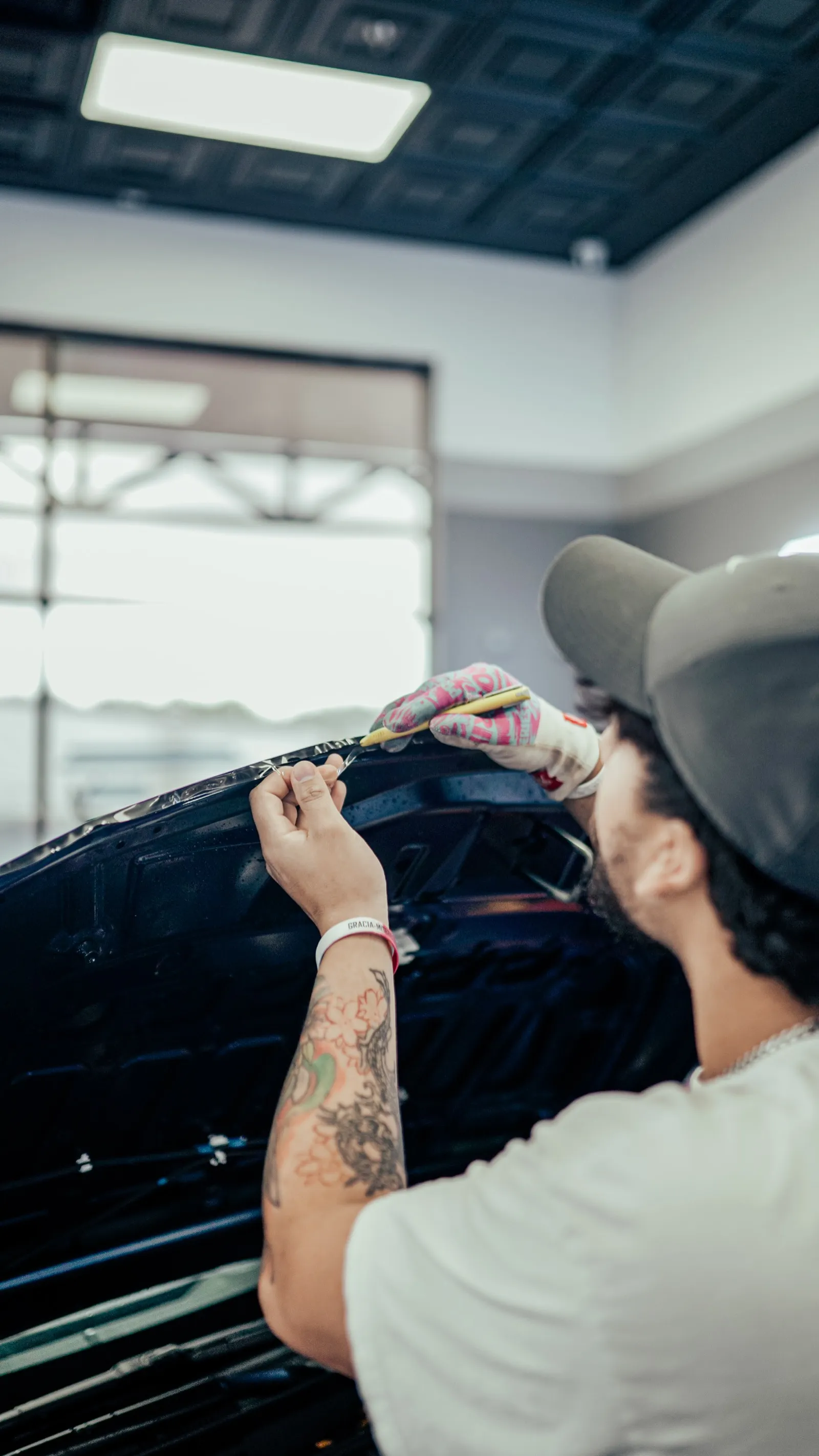 Paint protection film being installed on a car at Allure Auto Spa, Winter Park FL