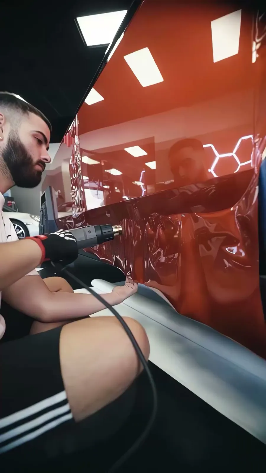 Tesla Cybertruck wrapped in red color-change vinyl at Allure Auto Spa, Winter Park FL