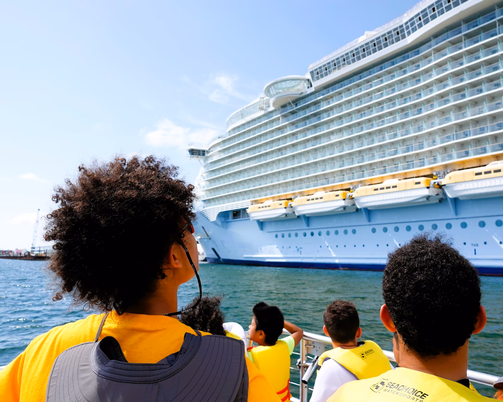 Kids watching cruise ship