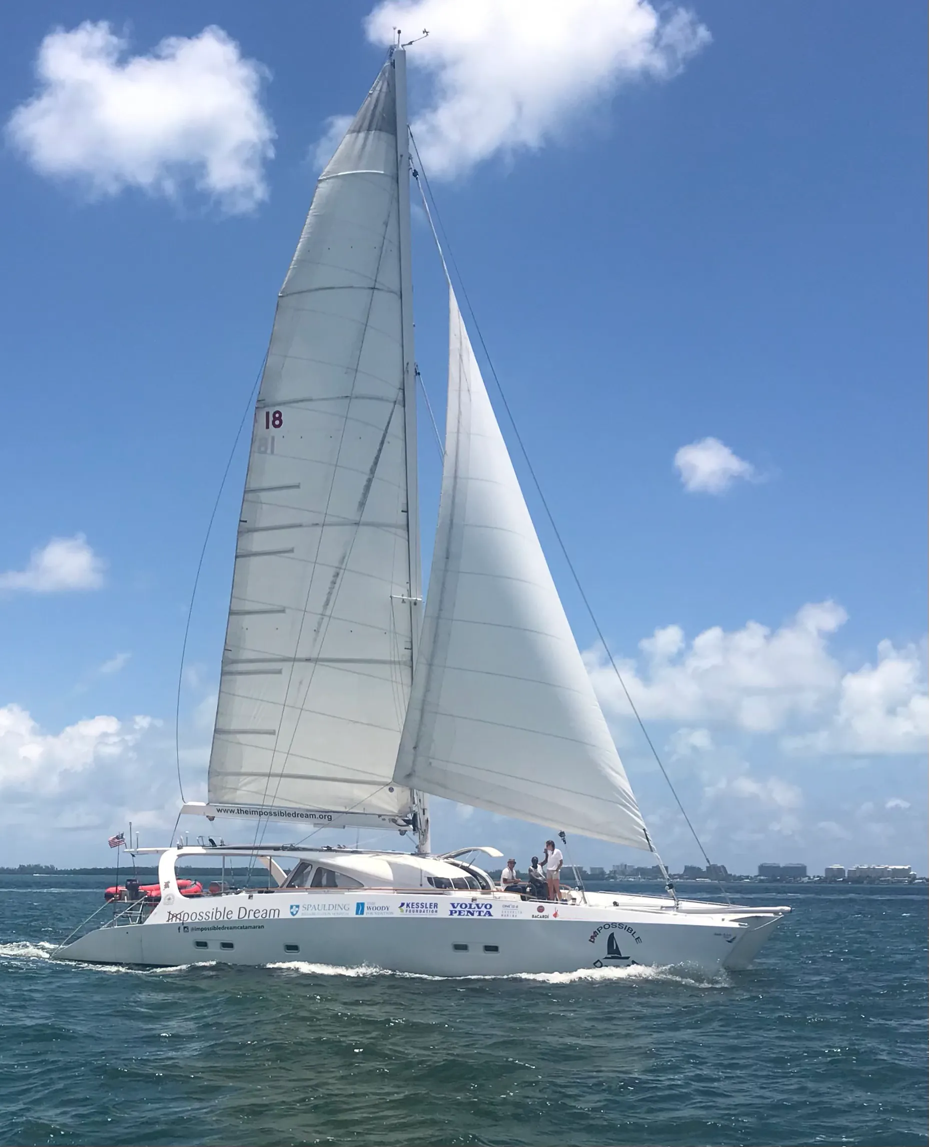 The Impossible Dream catamaran under full sail