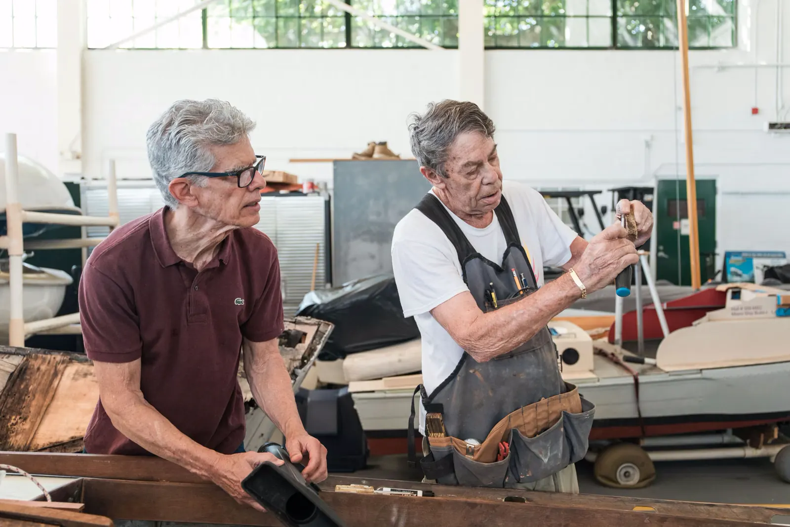 Craftsmen restoring a boat