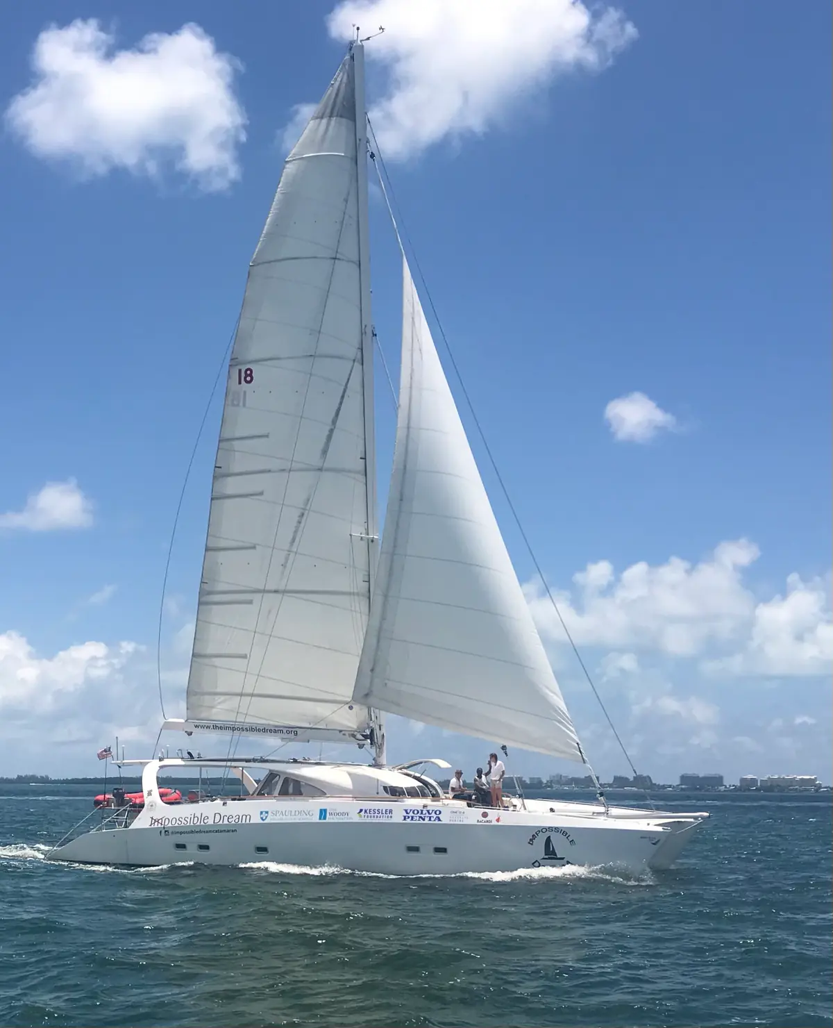 The Impossible Dream catamaran under full sail