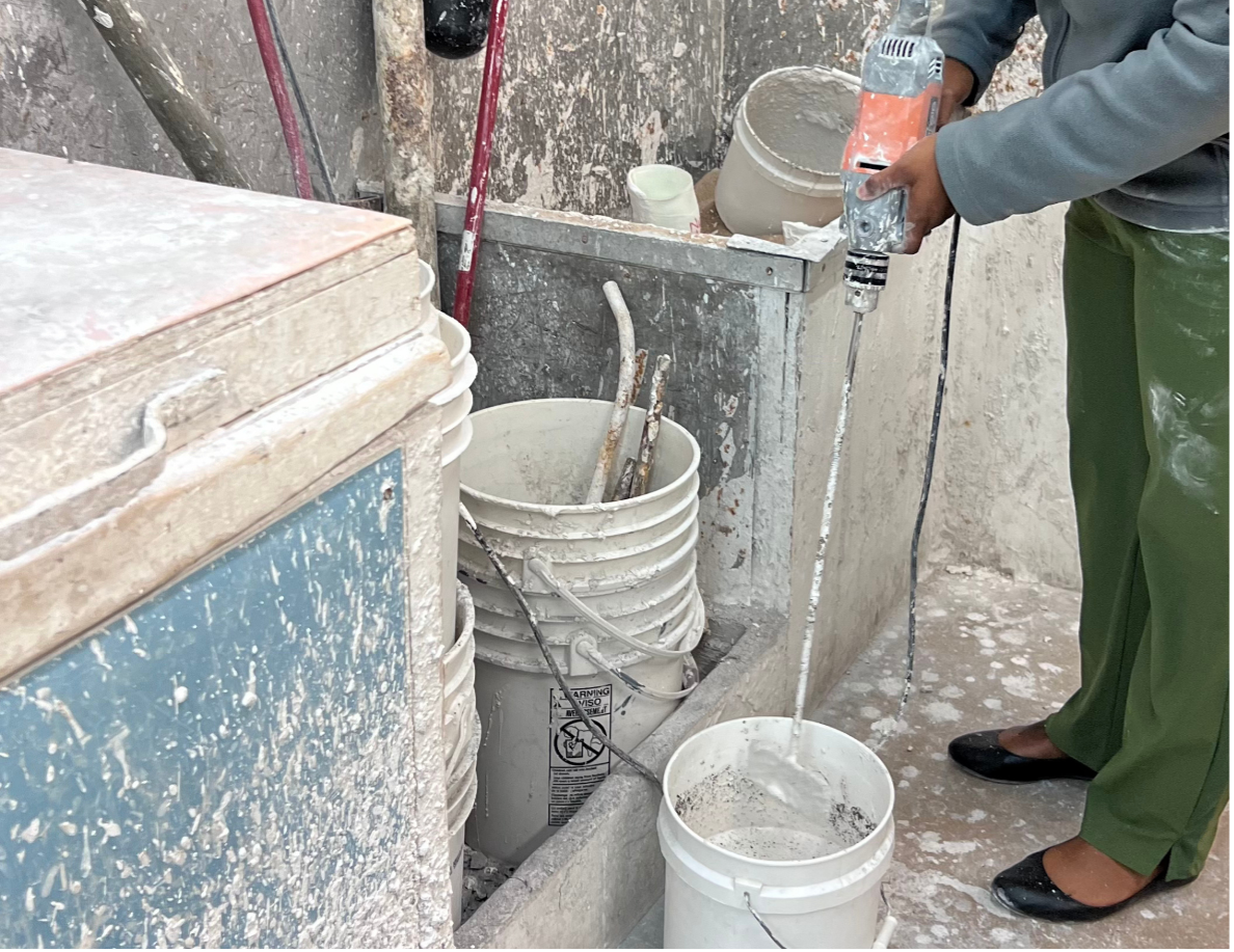 Orthotist manually mixing mold