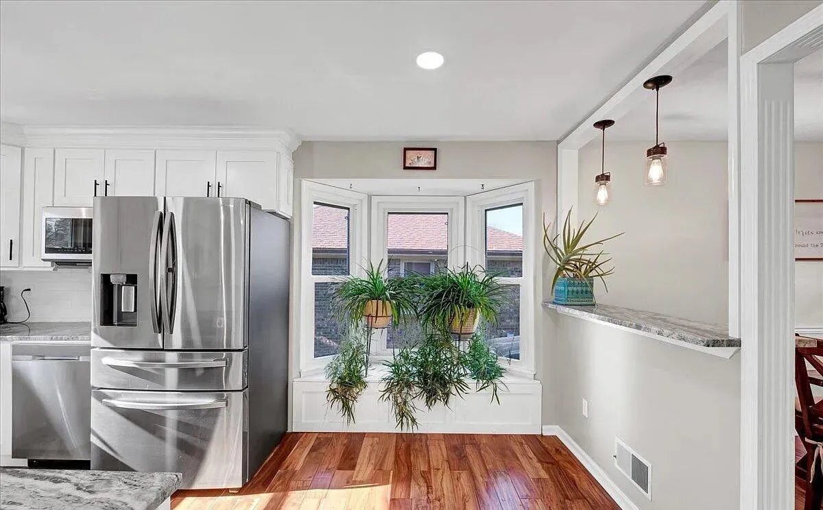 Renovated kitchen with bay window in a Louisville, KY home remodeled by Killian's Contracting Group