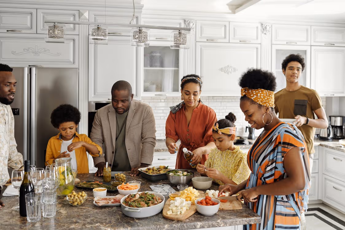 Free Family Preparing Food in the Kitchen Stock Photo