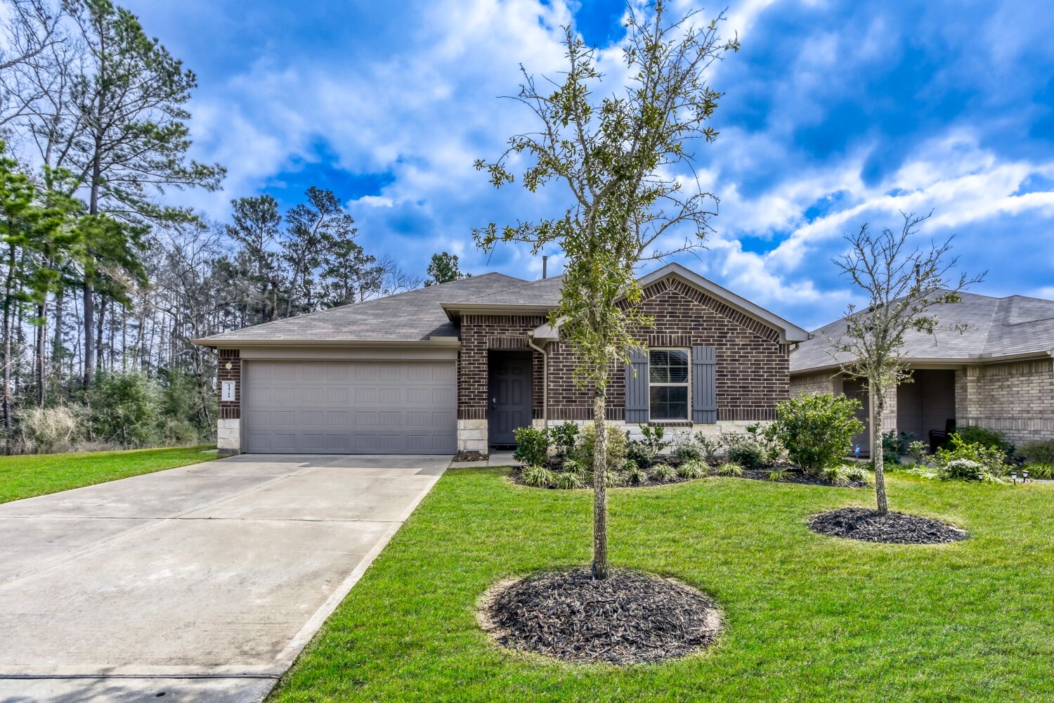 Two-story limestone and siding home in Austin managed by Texas Corporate Homes