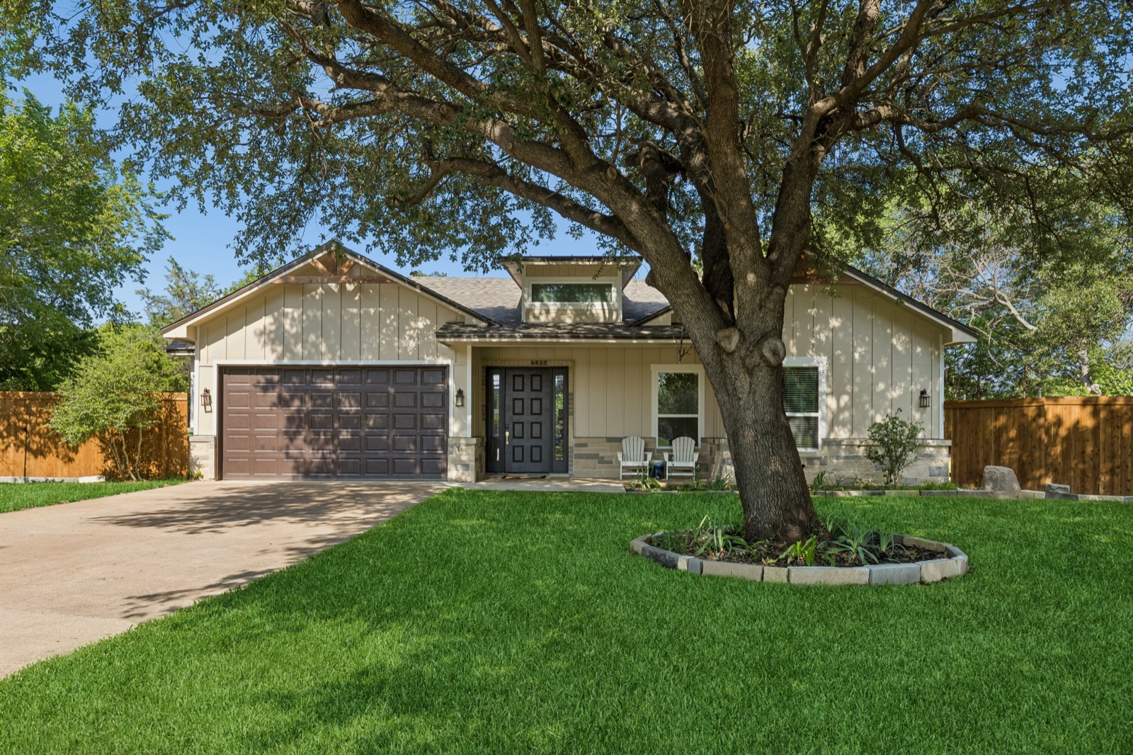 Exterior of a Texas Corporate Homes single-family rental with an oak tree