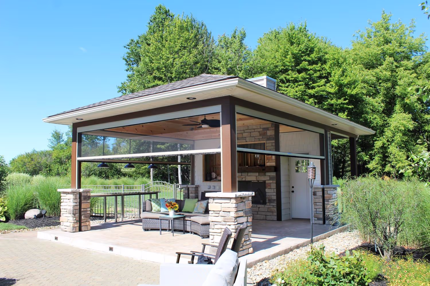 A gazebo with retractable screens installed.