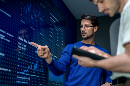 IT Help Desk agent pointing at AI automation metrics