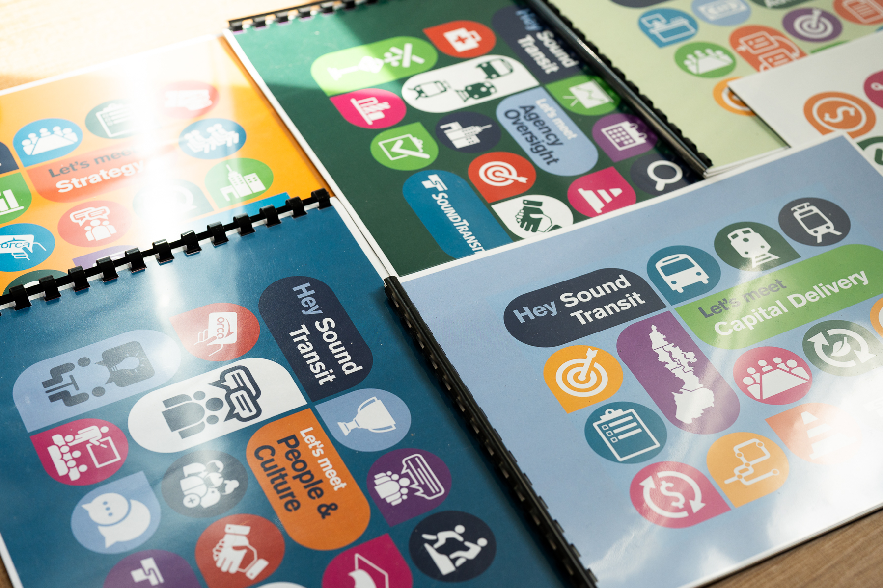 Printed folios that read "Hey Sound Transit" are scattered.