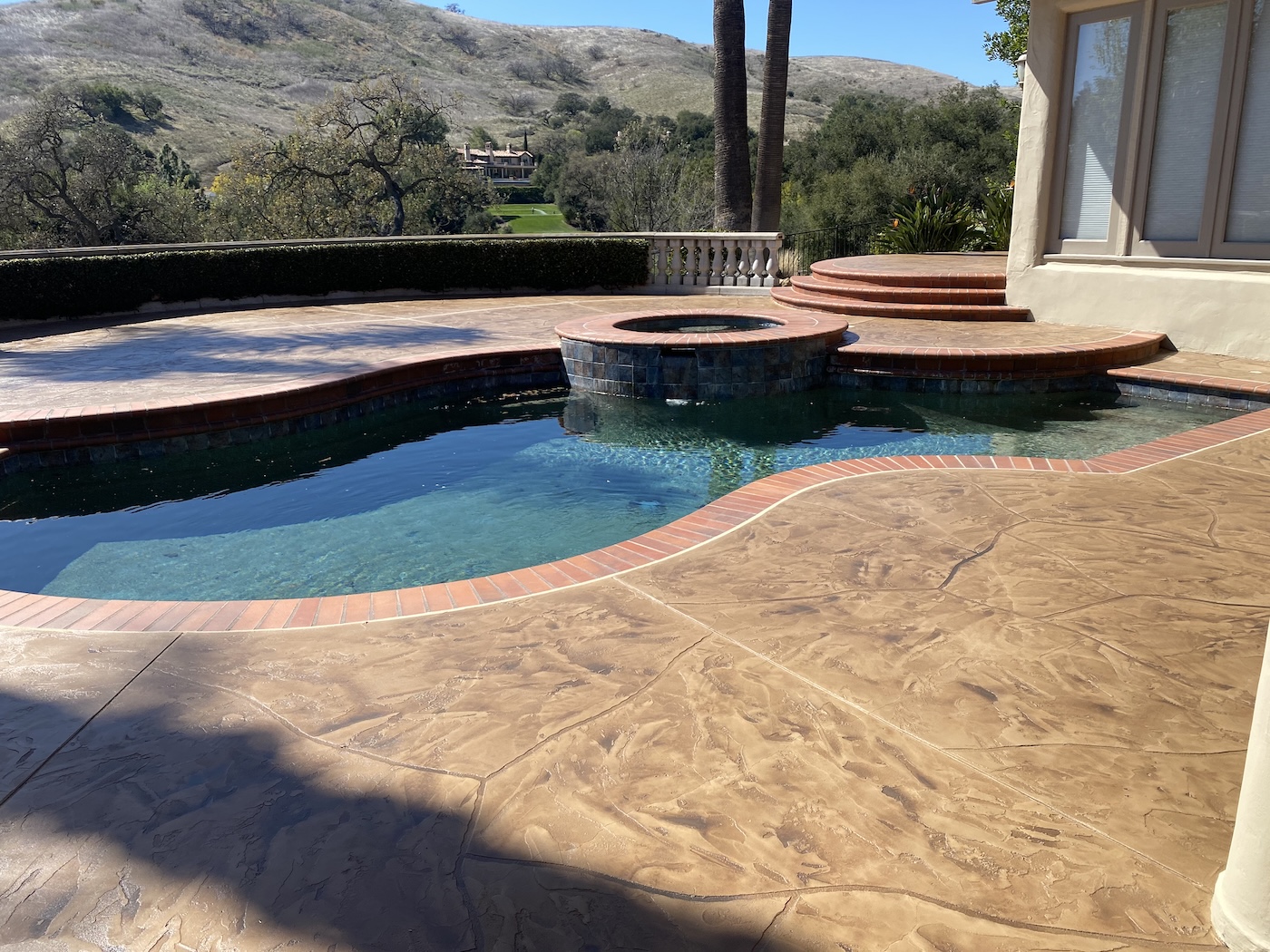 Pool deck concrete overlay and stain completed in Westlake Village, CA