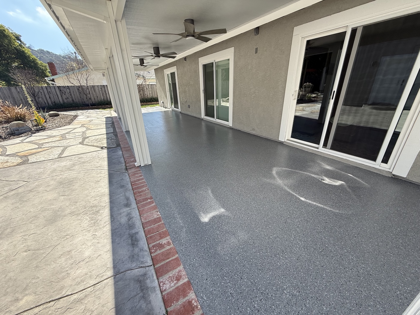 poly aspartic full flake coating applied to patio in oakview
