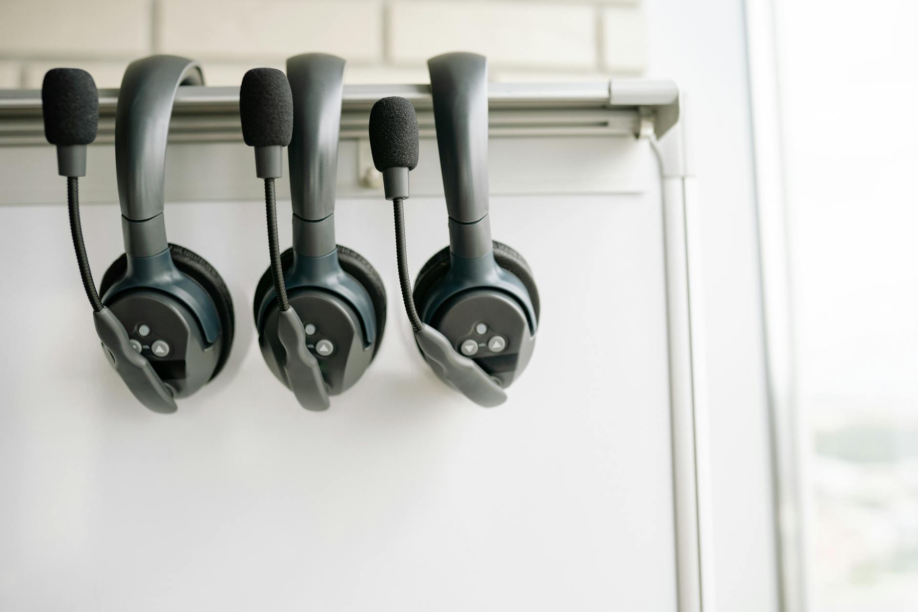 Customer service agent wearing a headset at a call center workstation