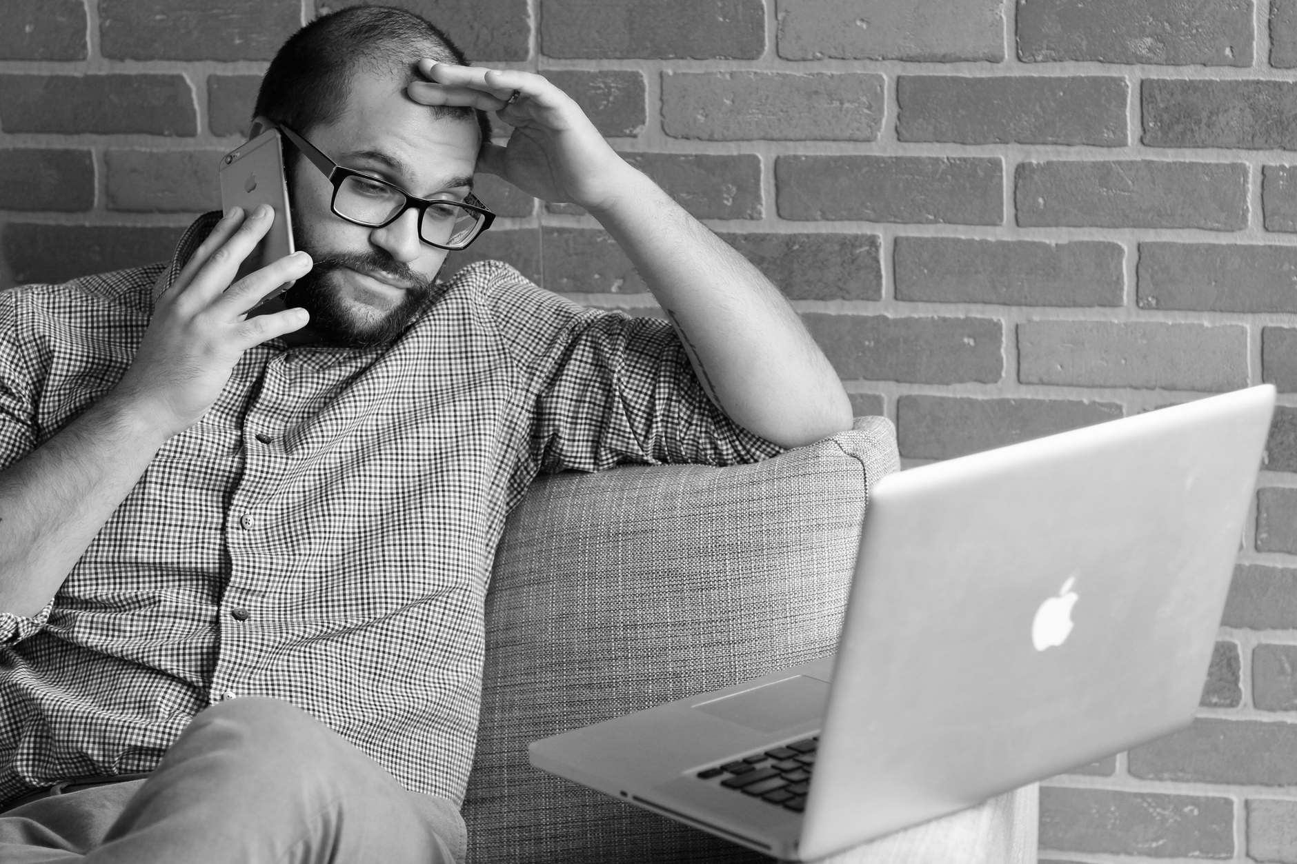 Worried man on a phone call, illustrating an AI voice-cloning virtual kidnapping scam