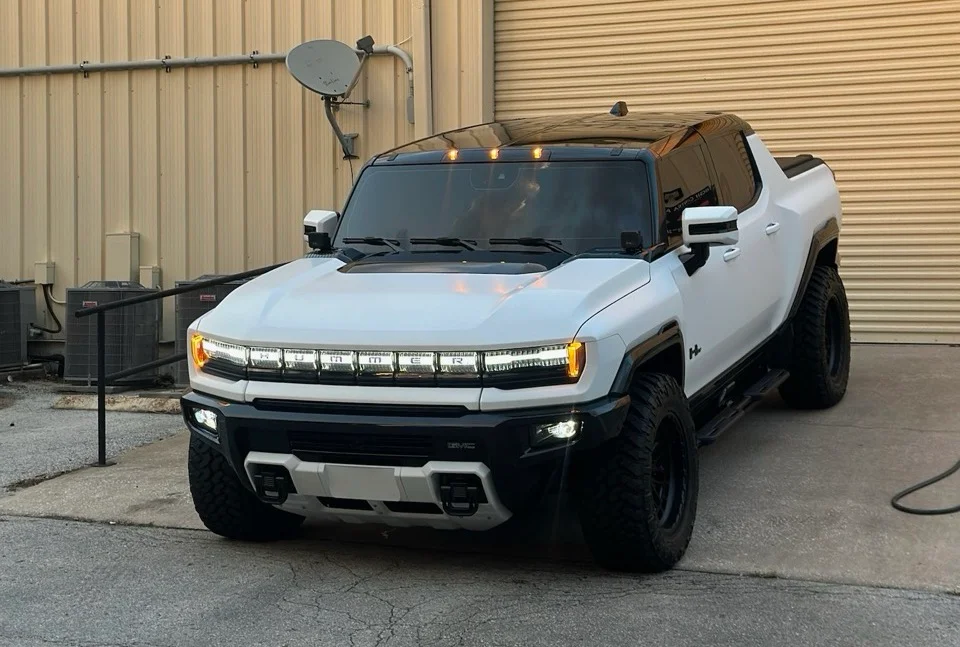 White GMC Hummer EV with gloss black roof after ceramic coating at Allure Auto Spa in Casselberry, Florida