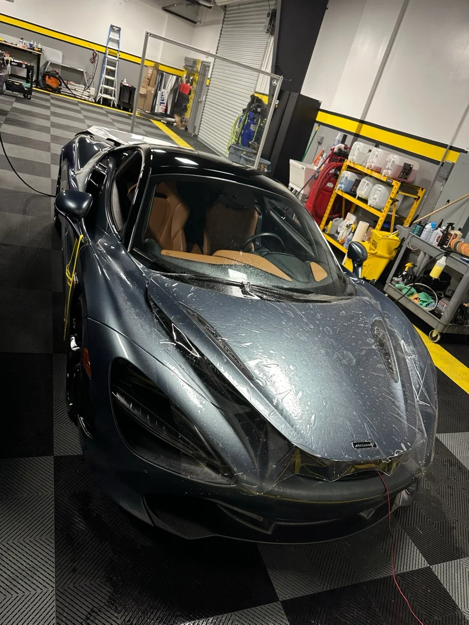 Full PPF being installed on a grey McLaren 720S at Allure Auto Spa in Casselberry, Florida