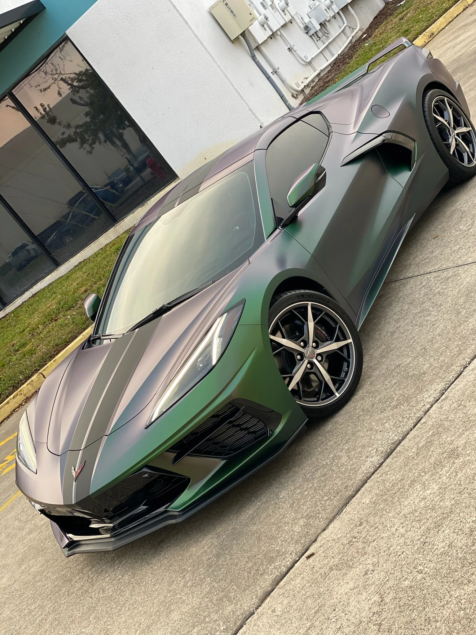 Chevrolet Corvette C8 with a chameleon satin wrap and dark ceramic window tint at Allure Auto Spa in Casselberry, Florida