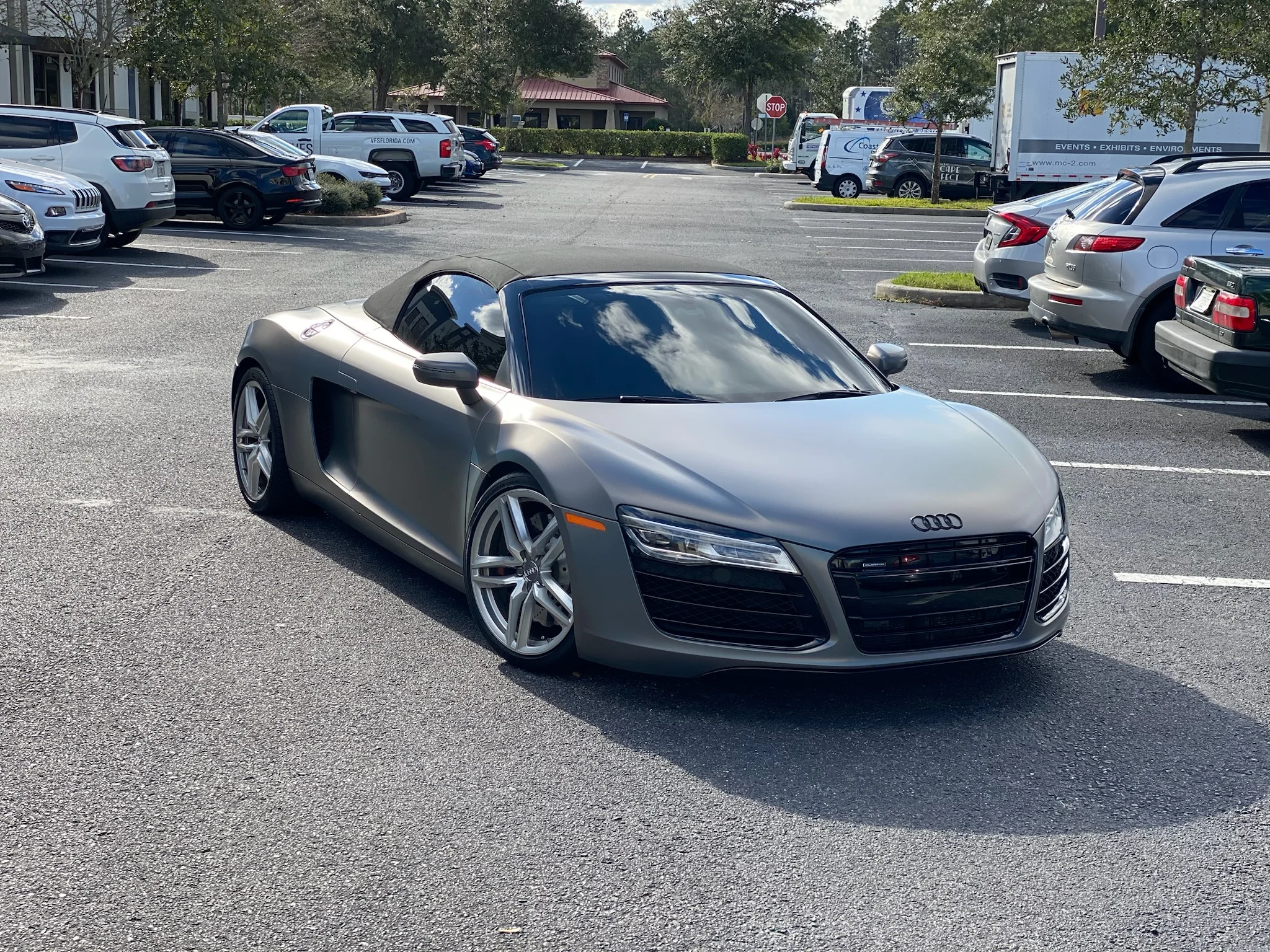 Audi R8 with satin gray wrap and tinted windows parked outside Allure Auto Spa in Casselberry, Florida