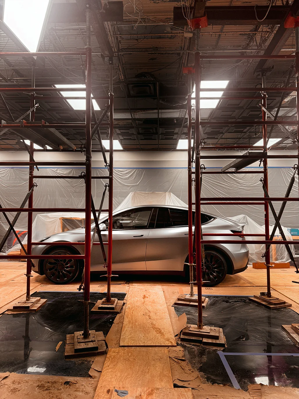 Side profile of a satin-wrapped Tesla Model Y staged during wrap installation at Allure Auto Spa in Casselberry, Florida