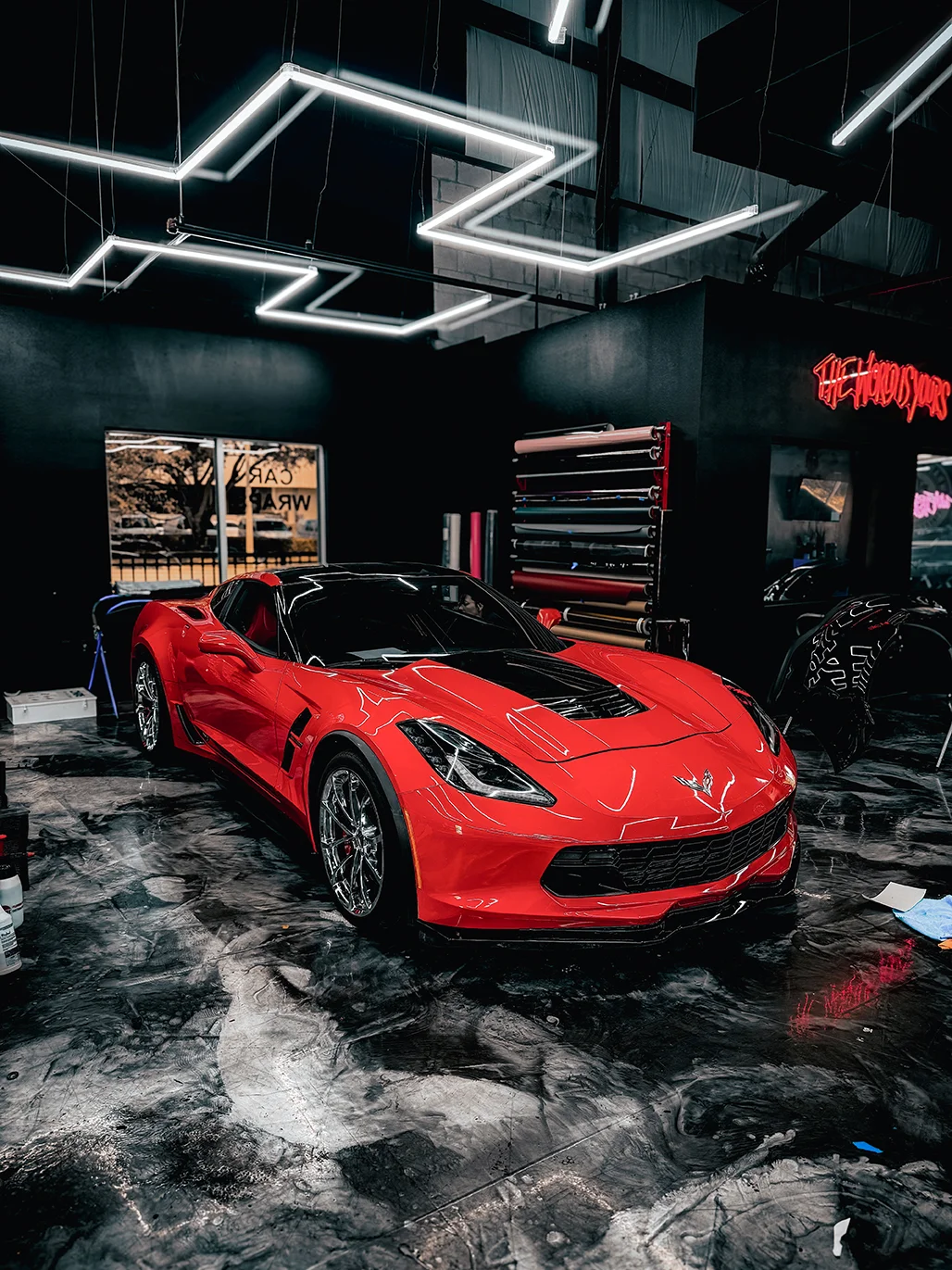 Red Corvette C7 with gloss black hood wrap completed at Allure Auto Spa in Casselberry, Florida