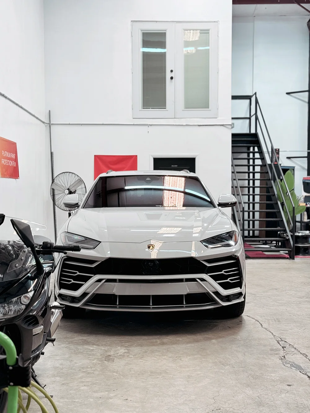 Front view of a Lamborghini Urus with satin wrap finish done at Allure Auto Spa in Casselberry, Florida